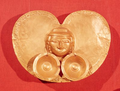 Pectoral with a human face wearing earrings, from Restrepo, Cauca Valley, Calima Period by Pre Columbian
